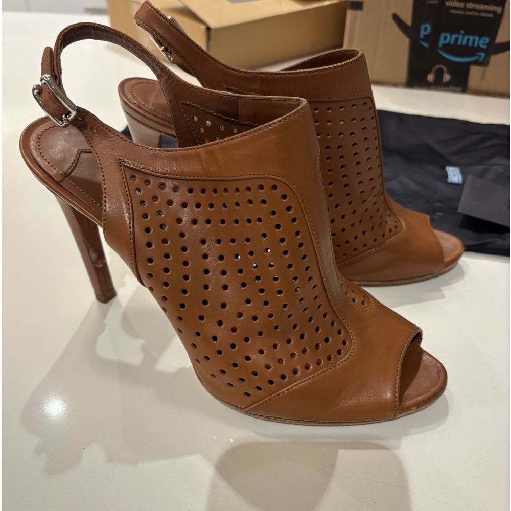 Prada peep toe sling backs 
Size 38.5
Brown/caramel